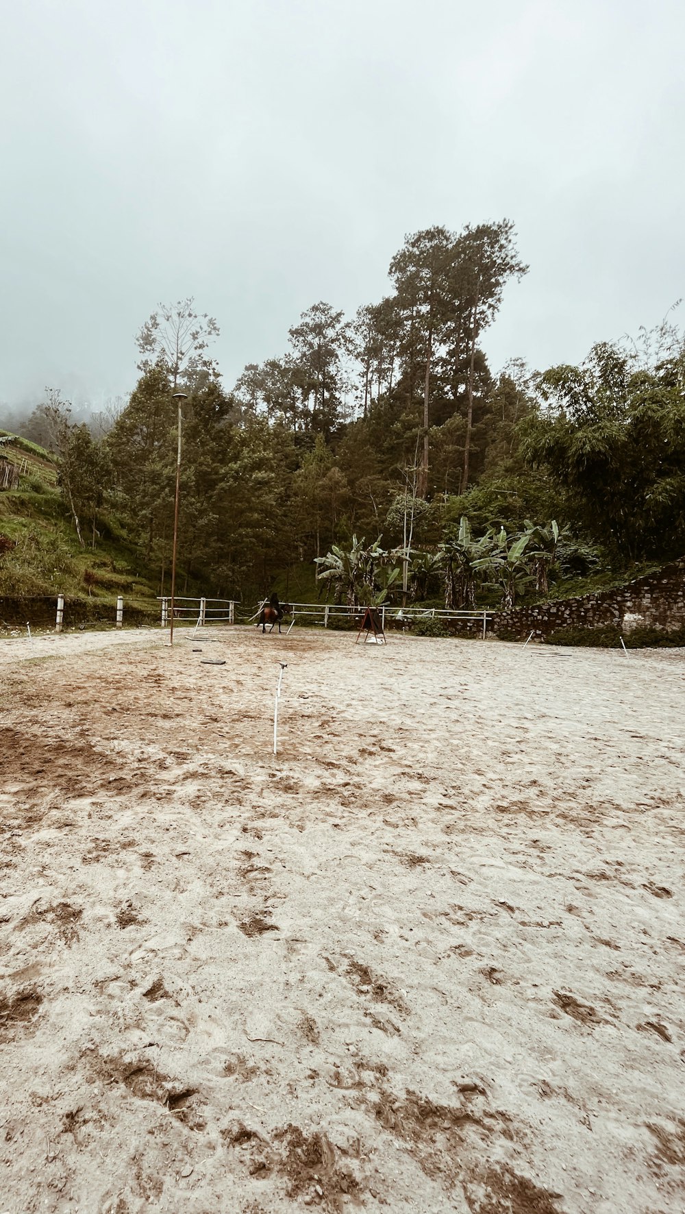 a beach with a volleyball net in the middle of it