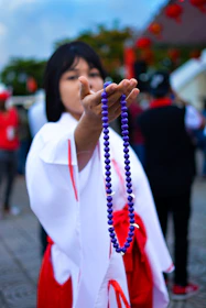 Diverse hands exchanging gifts with jewel-toned backgrounds.