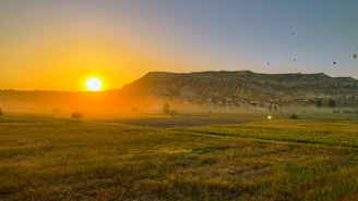 A scenic view of a famous international landmark bathed in golden sunset light, symbolizing adventure.