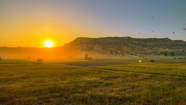 A scenic view of a famous international landmark bathed in golden sunset light, symbolizing adventure.