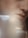 A close-up of a person's face features their lips, nose, and part of the cheek. The image has a soft focus with a hazy effect, creating an abstract and artistic composition. The lighting is gentle, highlighting the natural skin texture.