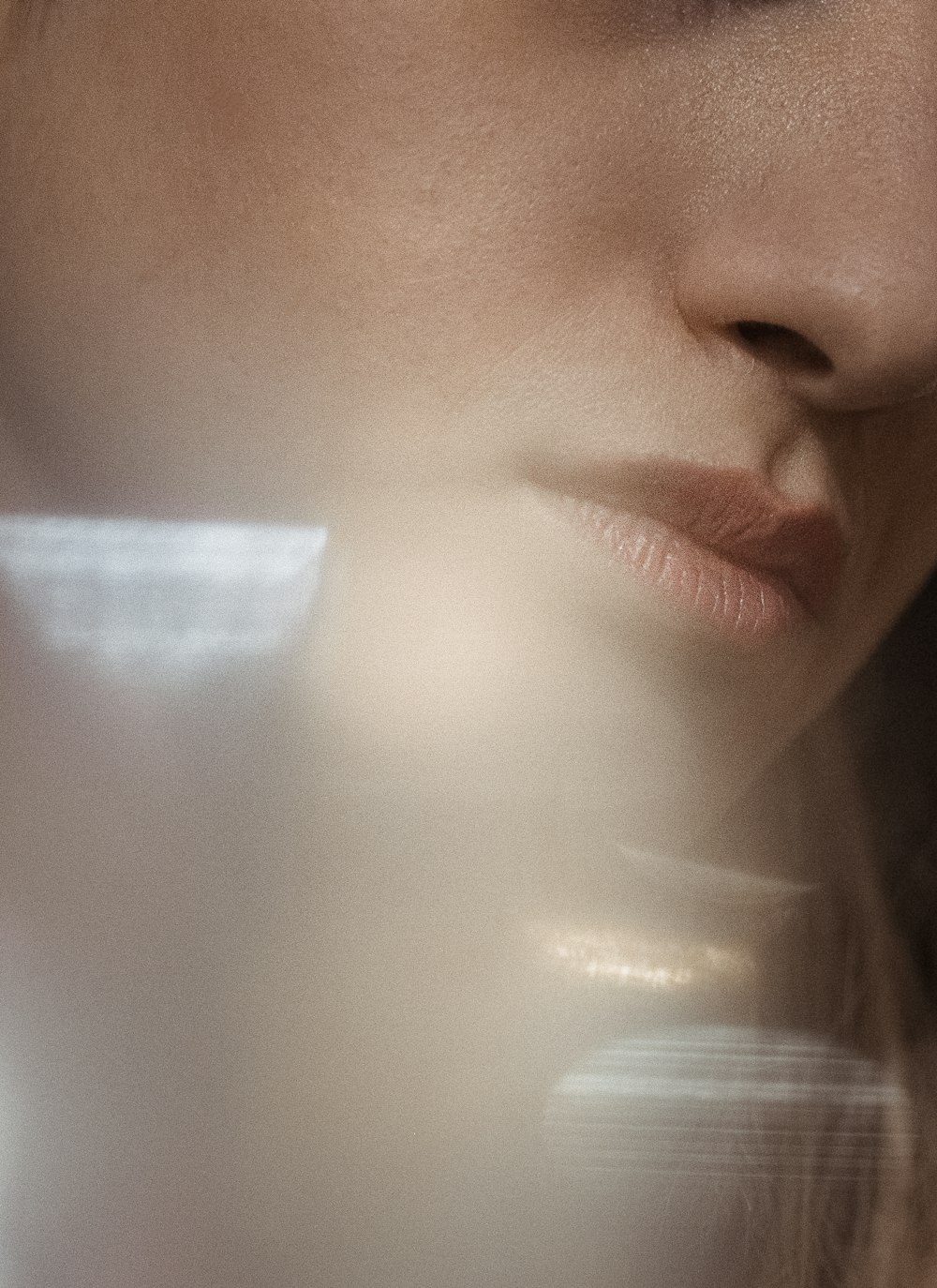 a close up of a woman's face with a blurry background