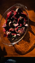 Close-up of rich red beetroot powder sprinkled gently on a white ceramic plate.