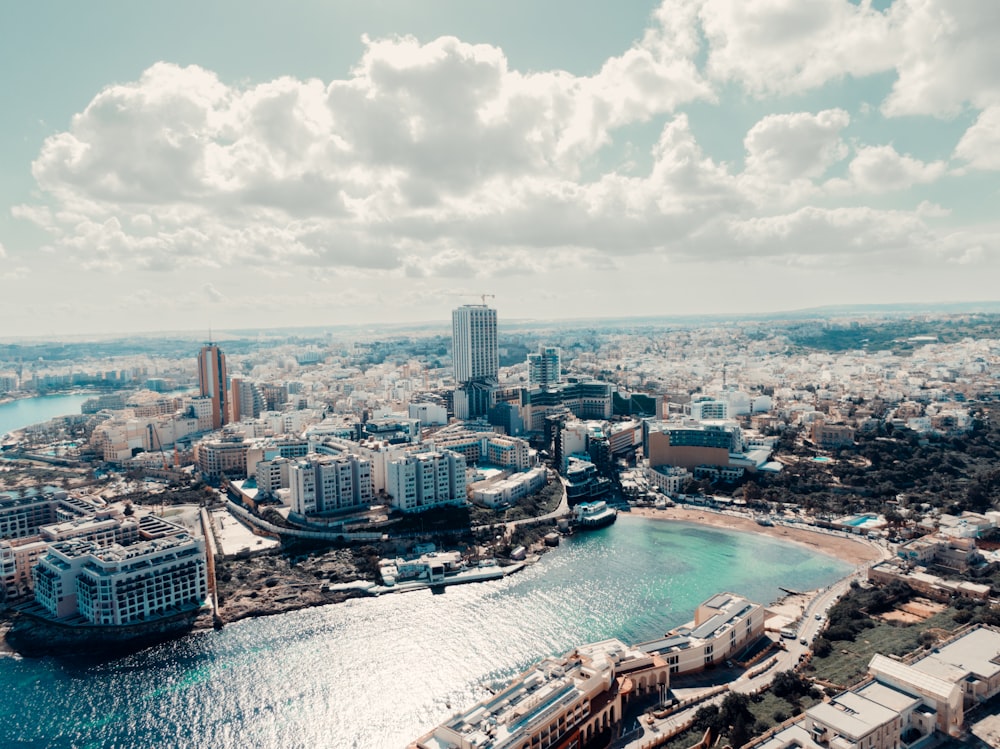 an aerial view of a city and a body of water