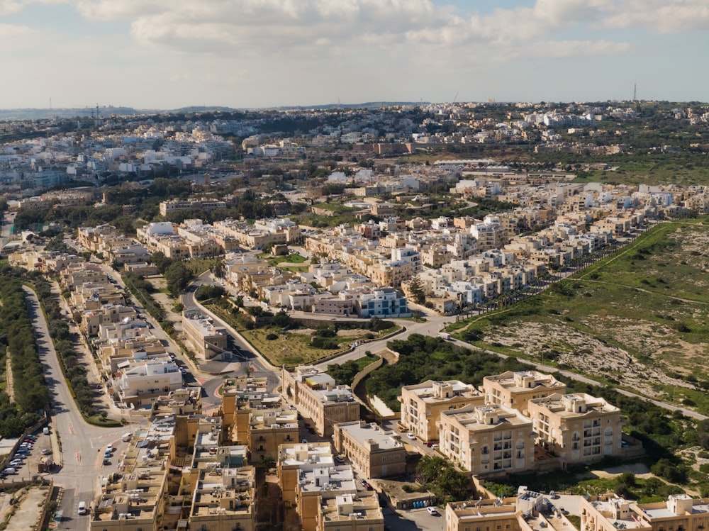 an aerial view of a city with lots of buildings