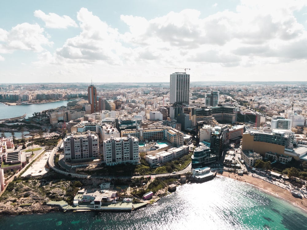 an aerial view of a city and a body of water