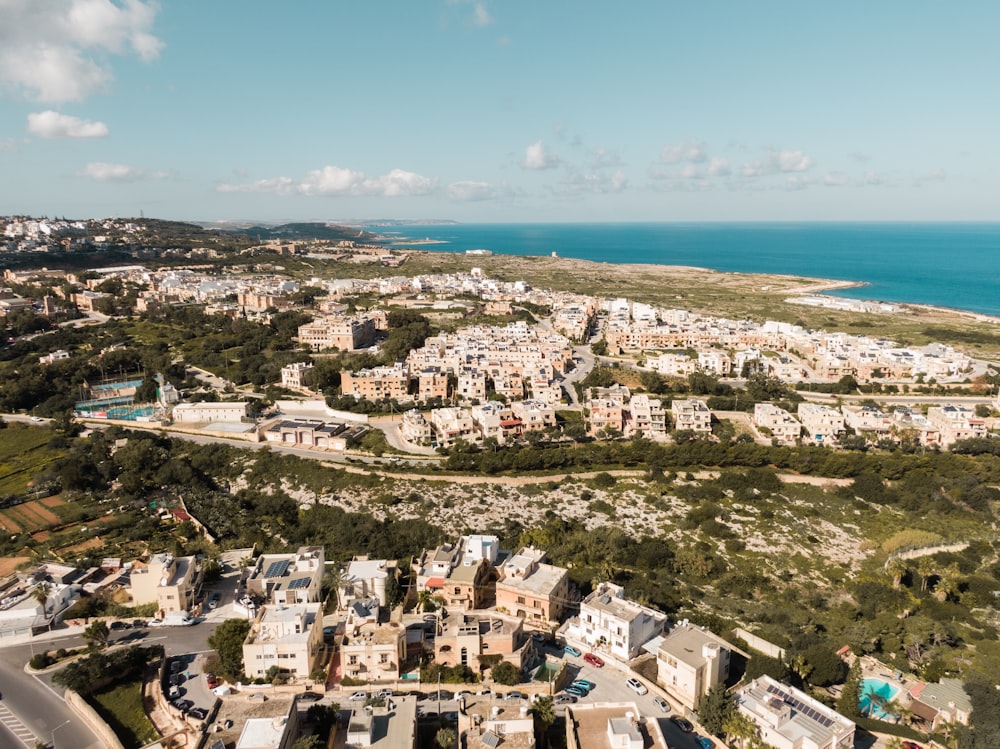 an aerial view of a city near the ocean