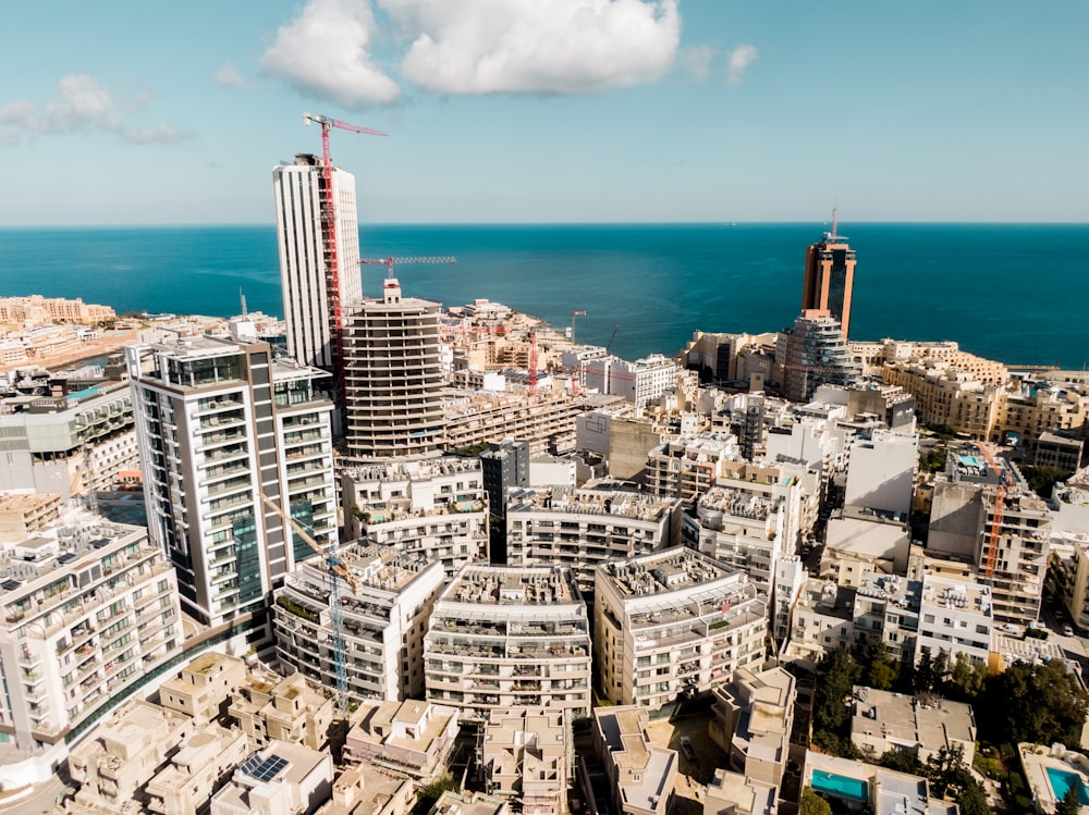 an aerial view of a city by the ocean