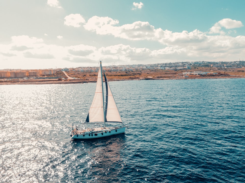 a sailboat sailing on a large body of water