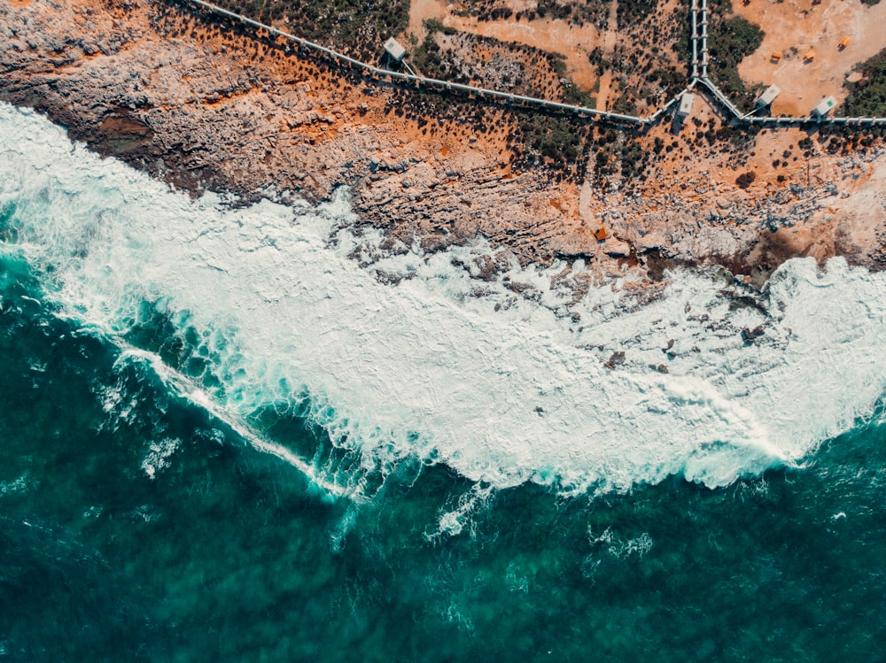 an aerial view of the ocean and land