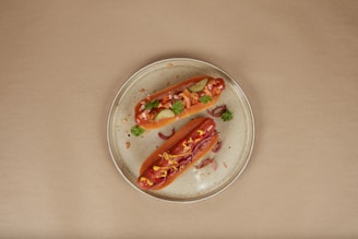 a couple of hot dogs on a plate