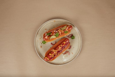 a couple of hot dogs on a plate