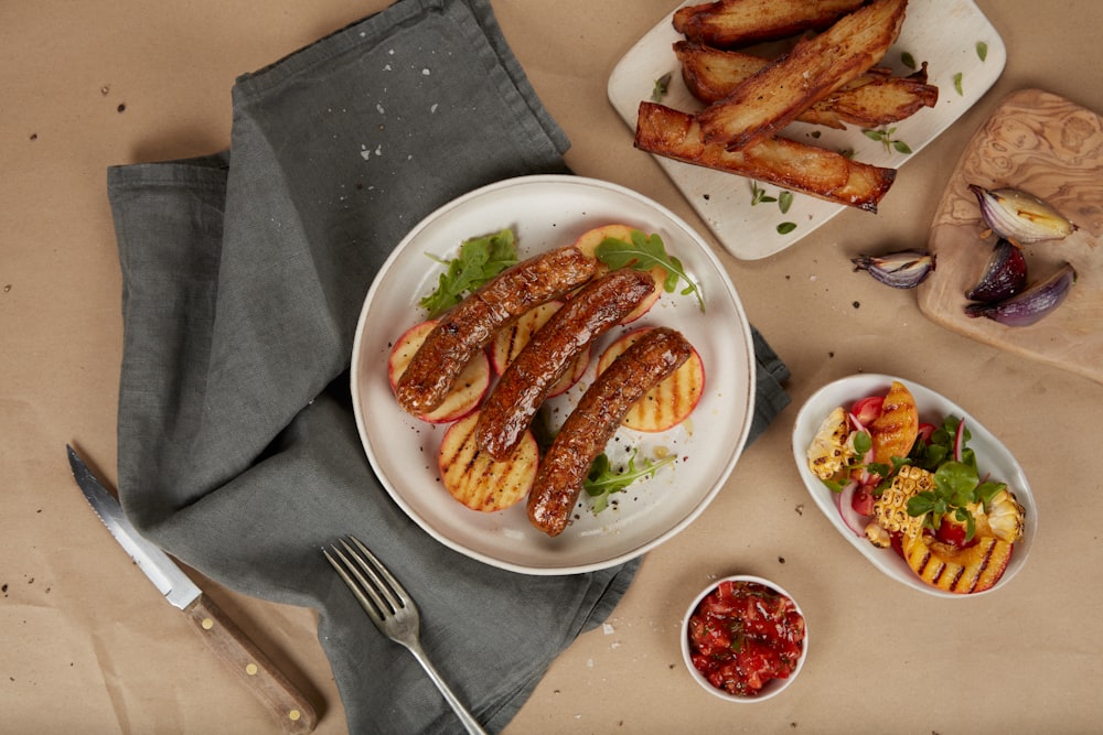 a plate of food on a table with a knife and fork