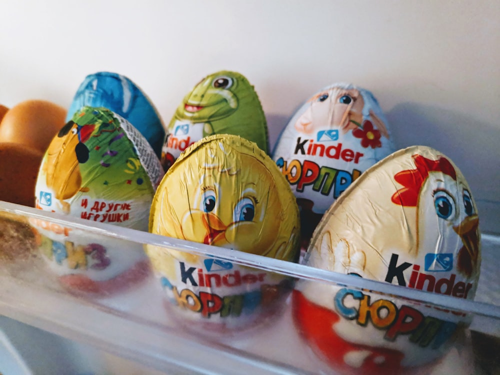 a bunch of kinder eggs in a refrigerator