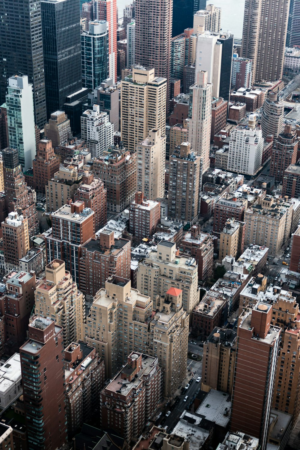 an aerial view of a city with tall buildings