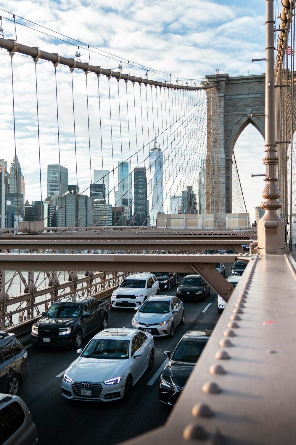 a view of a bridge with cars driving on it