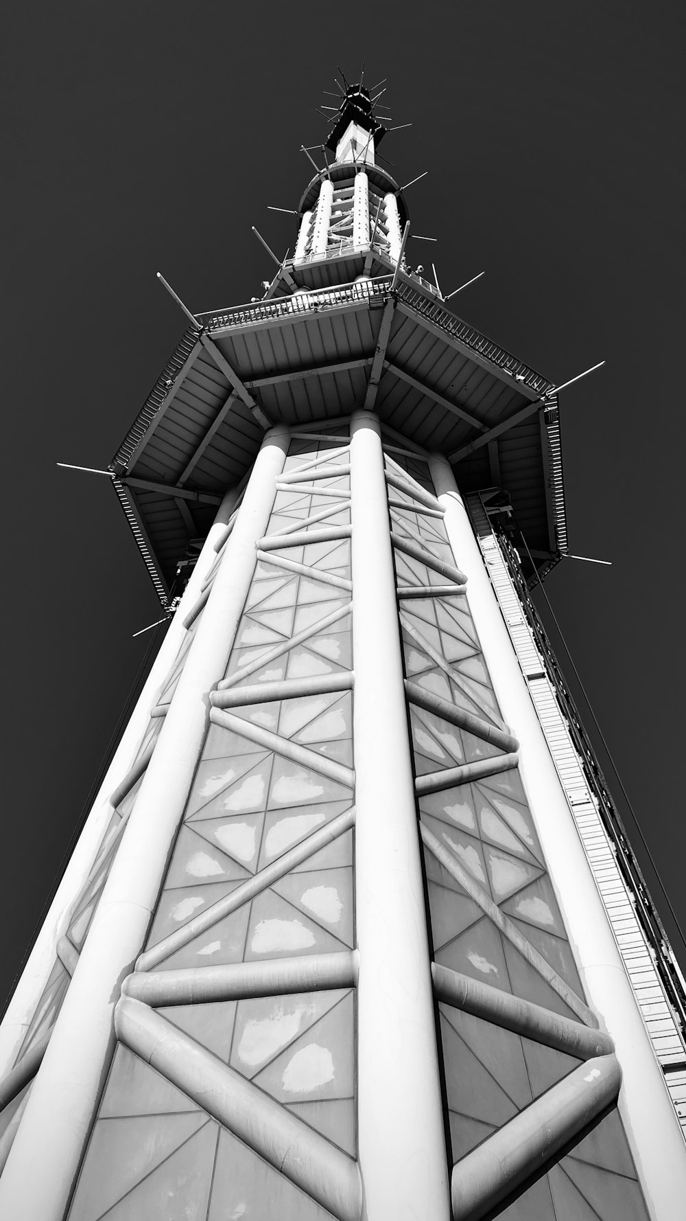 a black and white photo of a tall tower