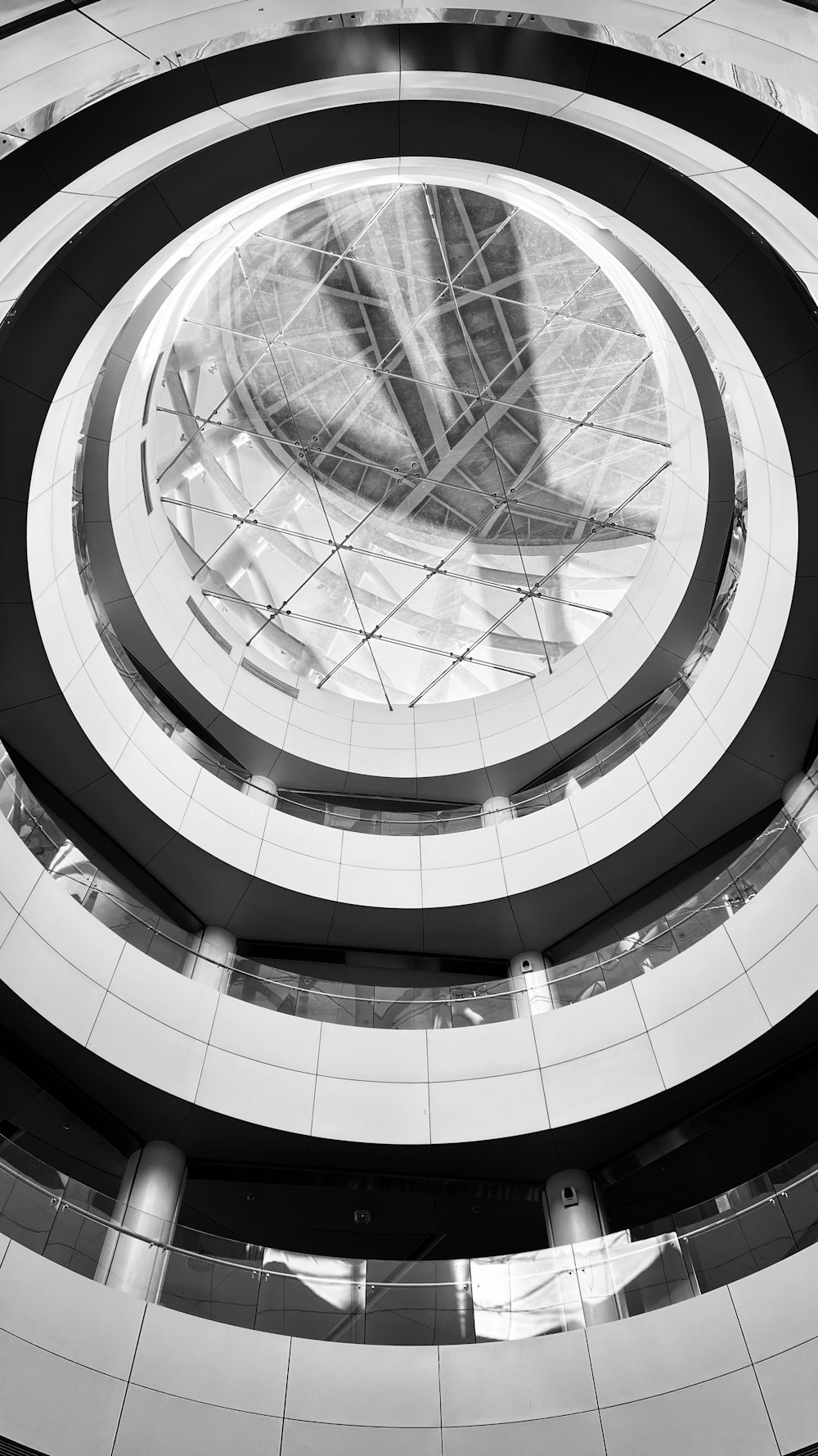 a black and white photo of a circular building