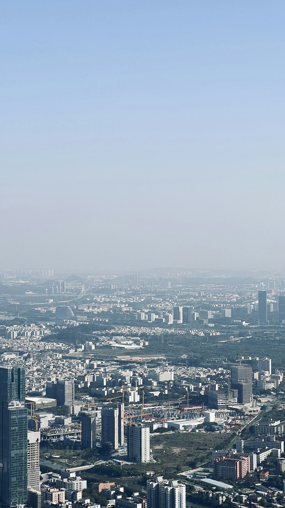 an aerial view of a city with tall buildings