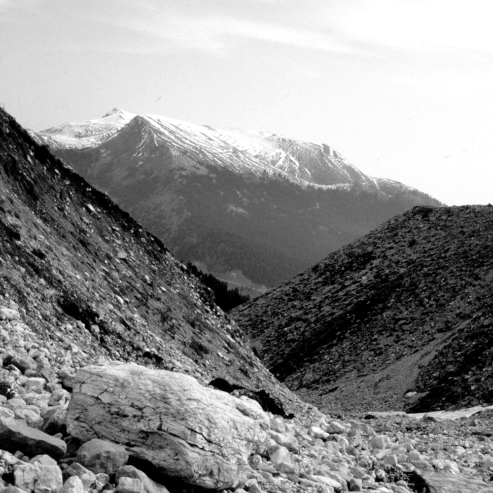 a black and white photo of a rocky mountain
