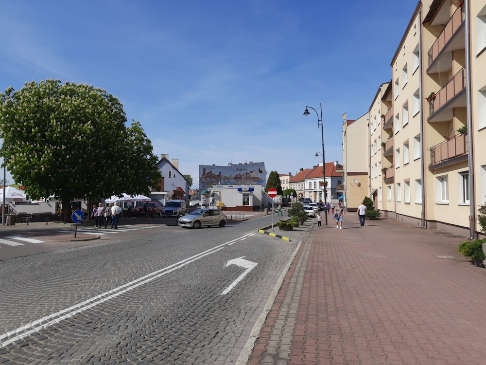 a city street with cars parked on the side of it