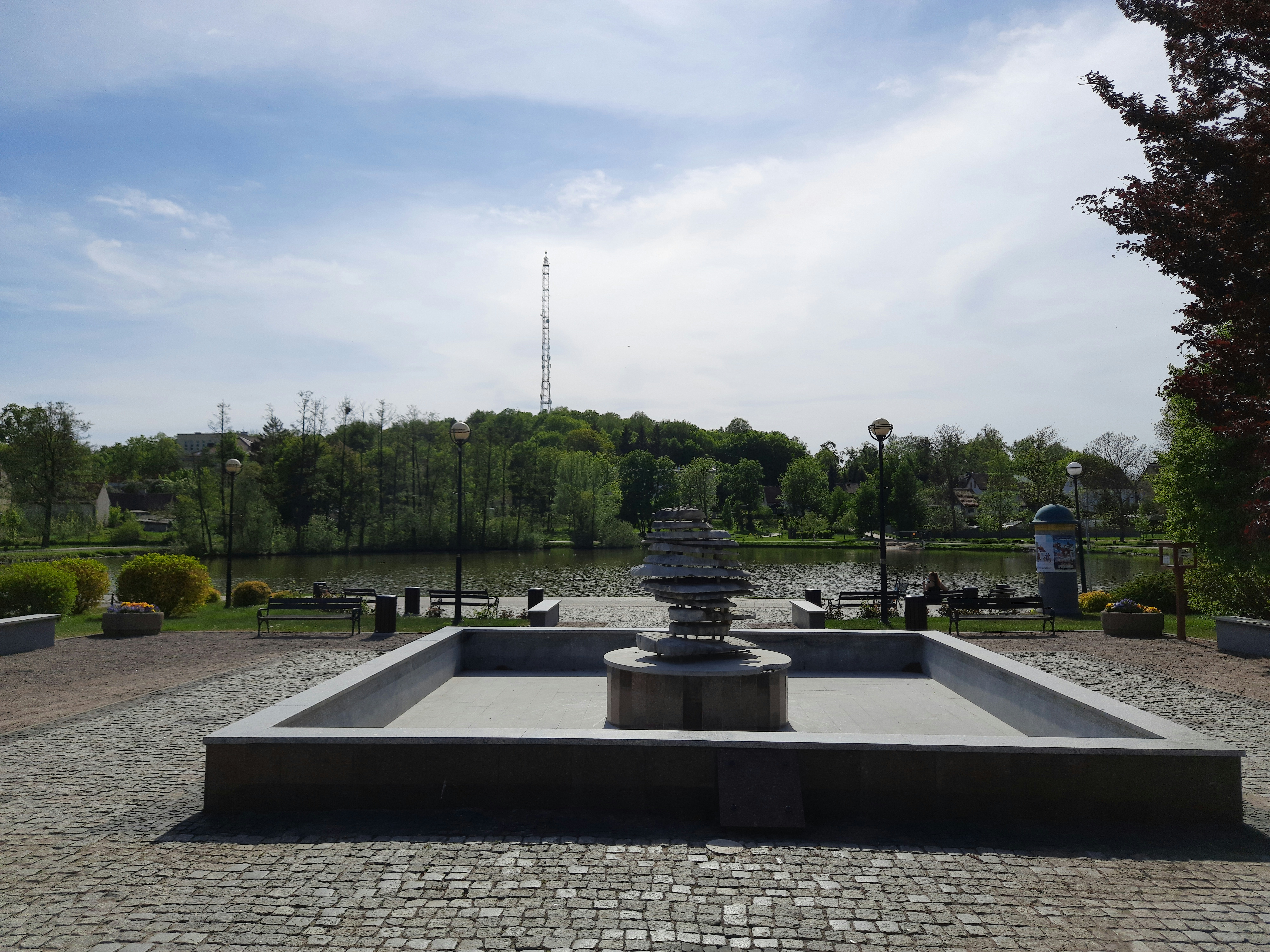 a fountain in the middle of a park