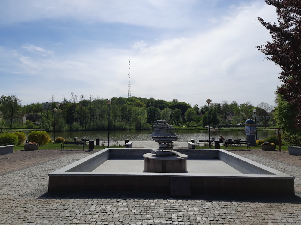 a fountain in the middle of a park