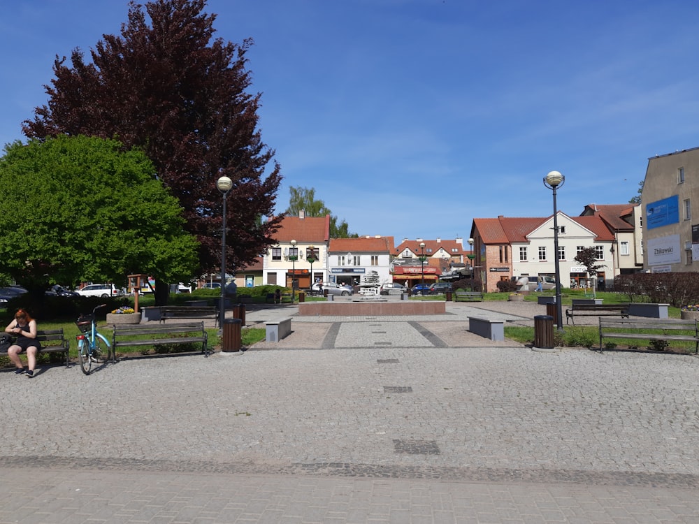 a person riding a bike in a park