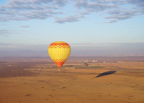 a hot air balloon in the middle of a desert