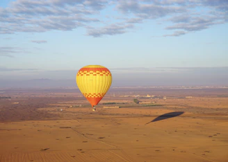 a hot air balloon in the middle of a desert