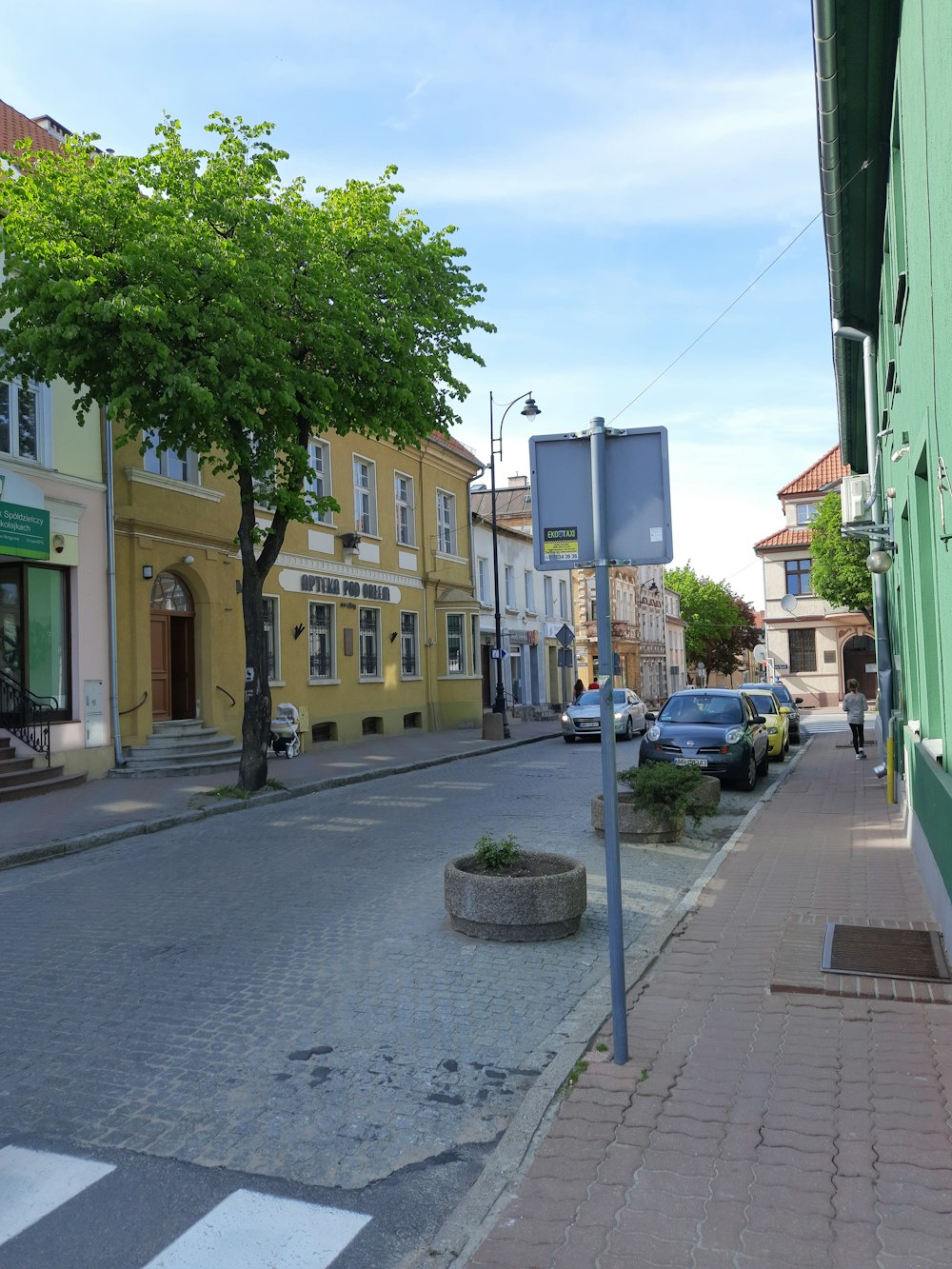 a street with cars parked on the side of it