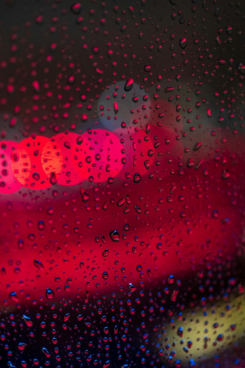 a close up of a rain covered window