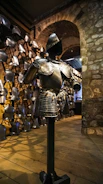 A sturdy body armor vest displayed on a mannequin against a neutral background