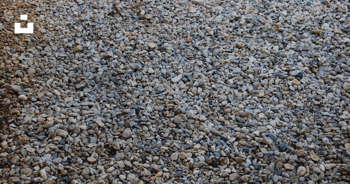 A bunch of rocks that are laying on the ground photo – Free Small rocks ...
