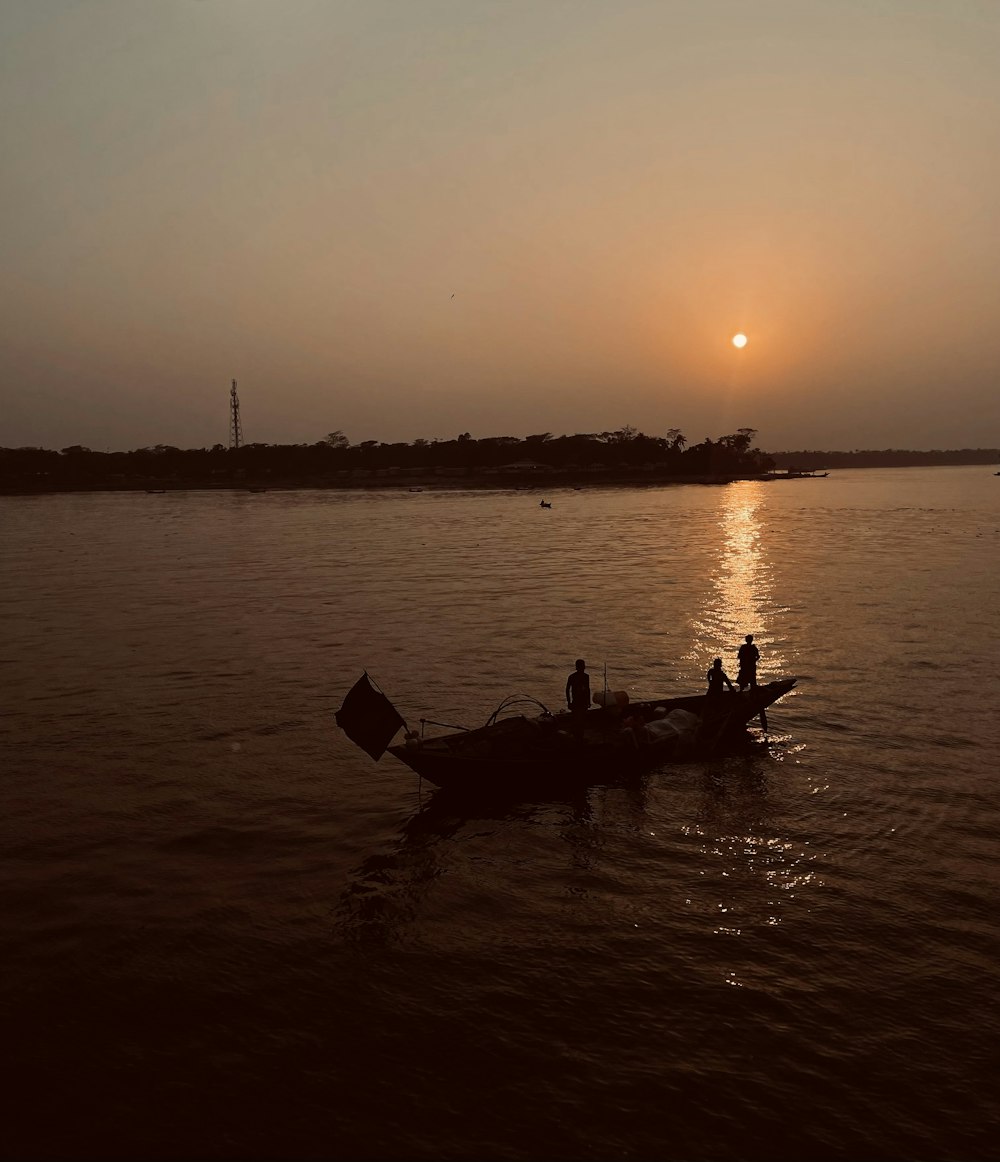 a couple of people on a small boat in the water