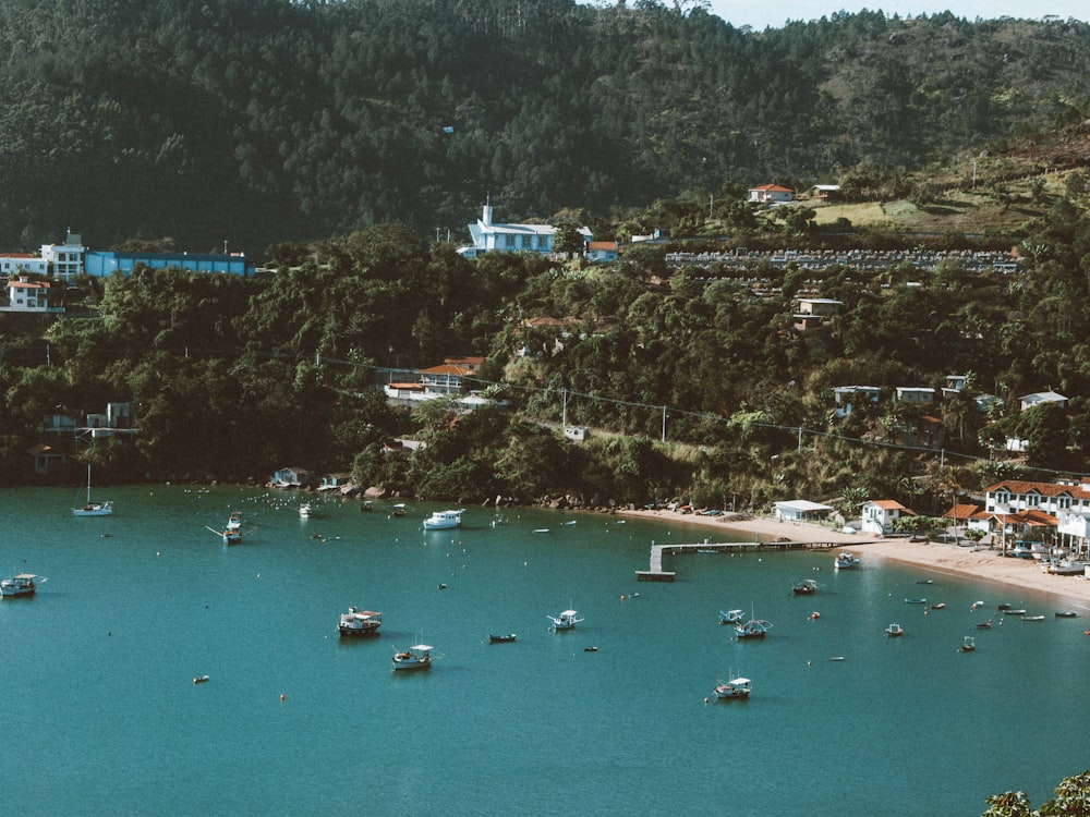 a group of boats floating on top of a lake