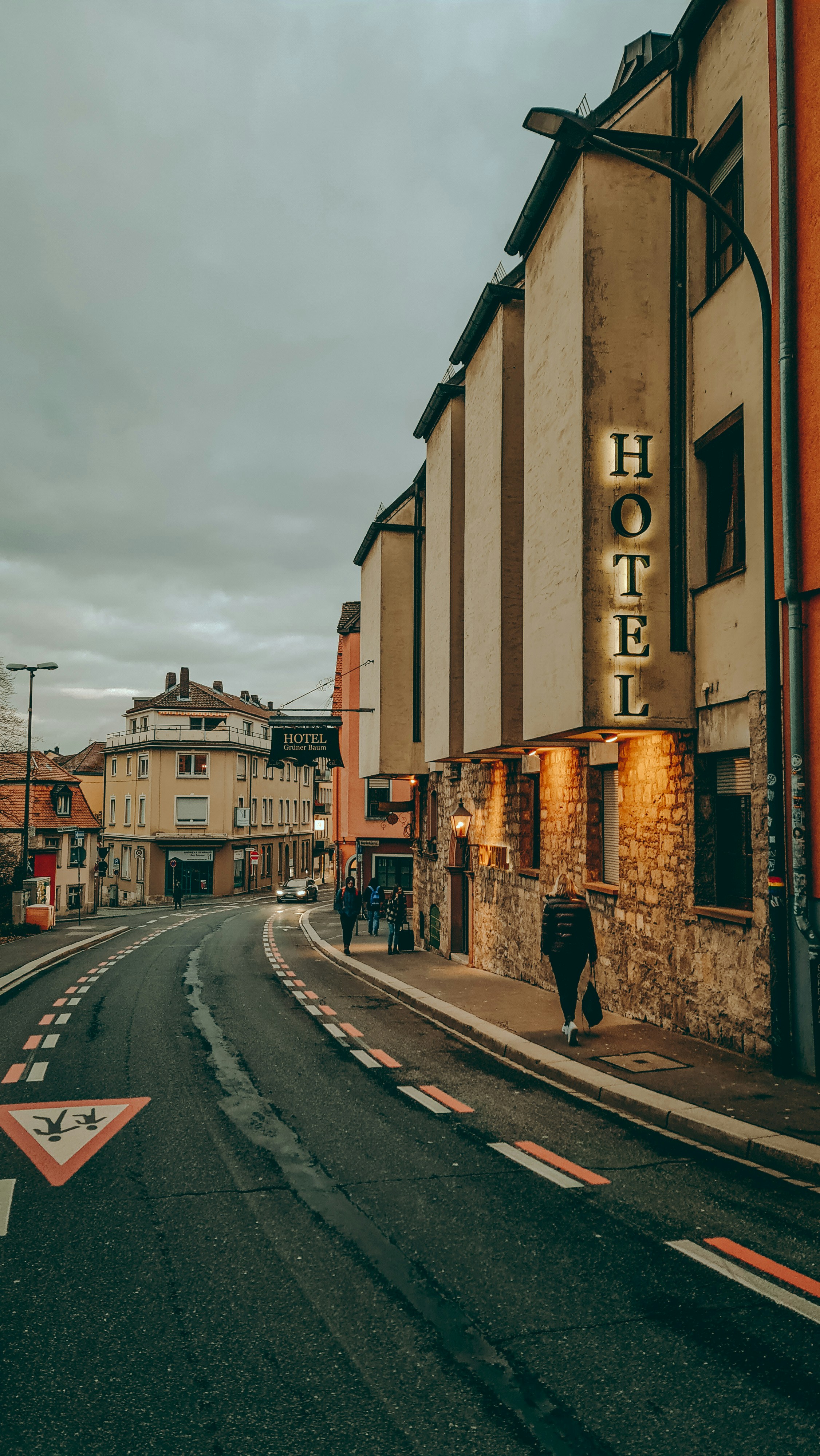 a street with a hotel sign on the side of it