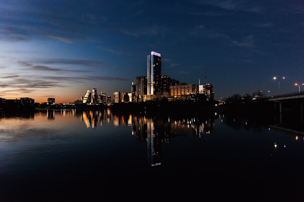 a large body of water with a city in the background