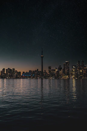 A sleek metal print featuring the CN Tower illuminated against a twilight sky.