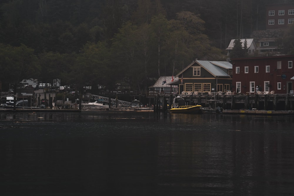 a body of water next to a red building