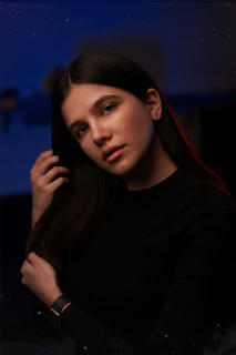 A cinematic portrait of Vanessa Chinchilla in soft mocha lighting, evoking resilience and introspection.