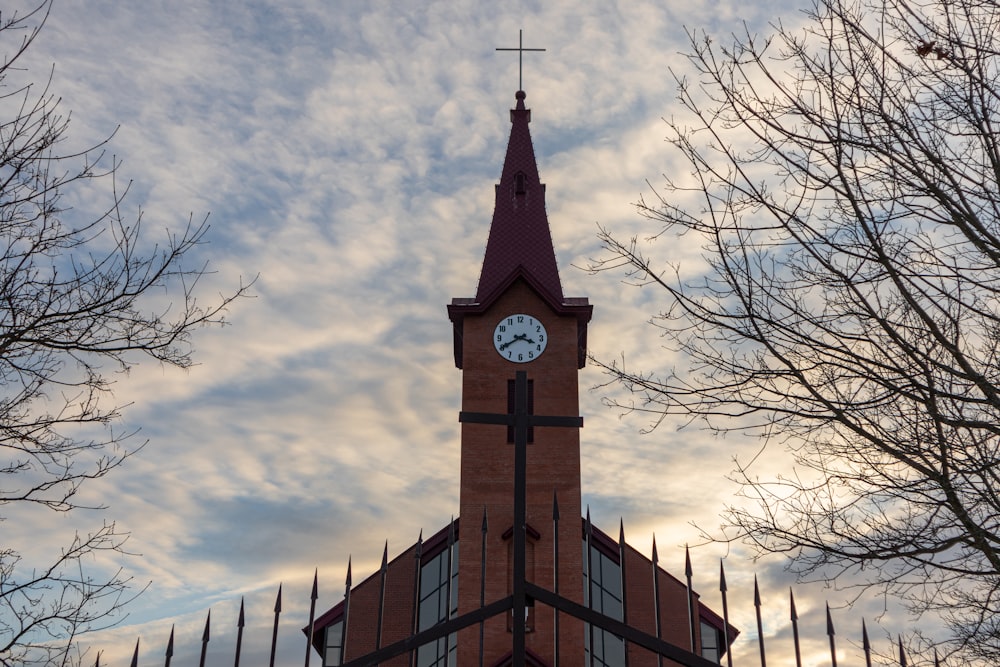 a church steeple with a clock at the top