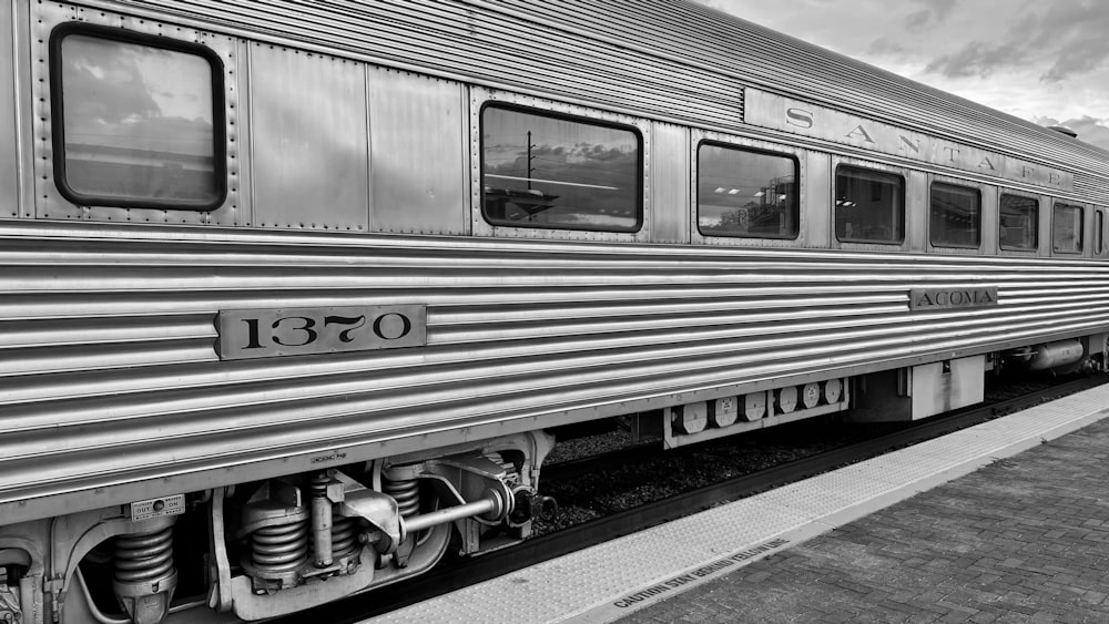 a black and white photo of a train