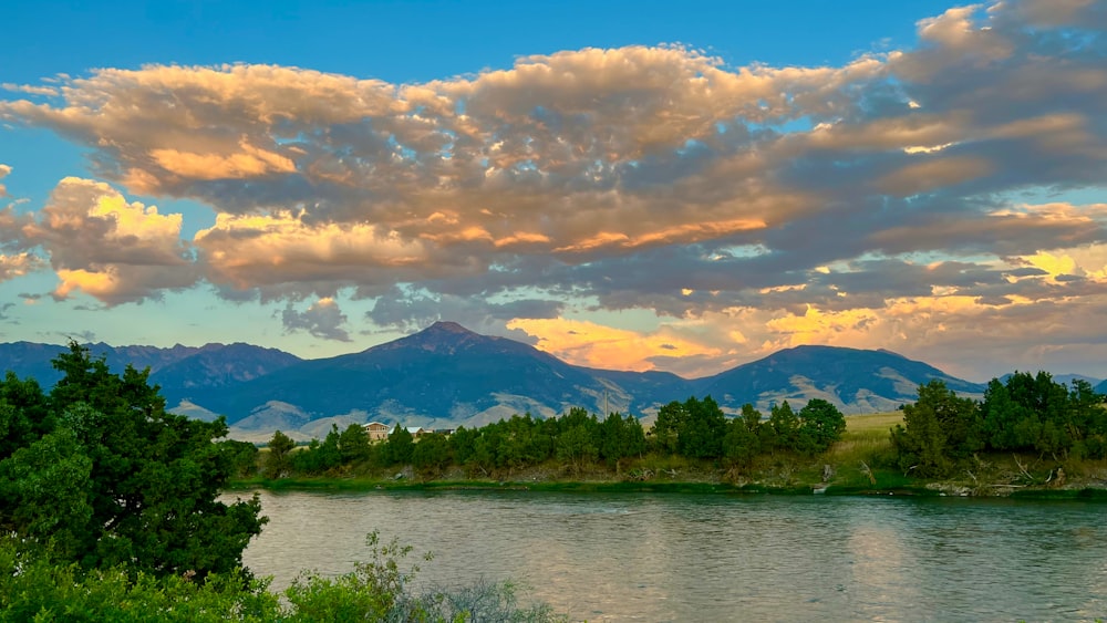 a river with a mountain range in the background