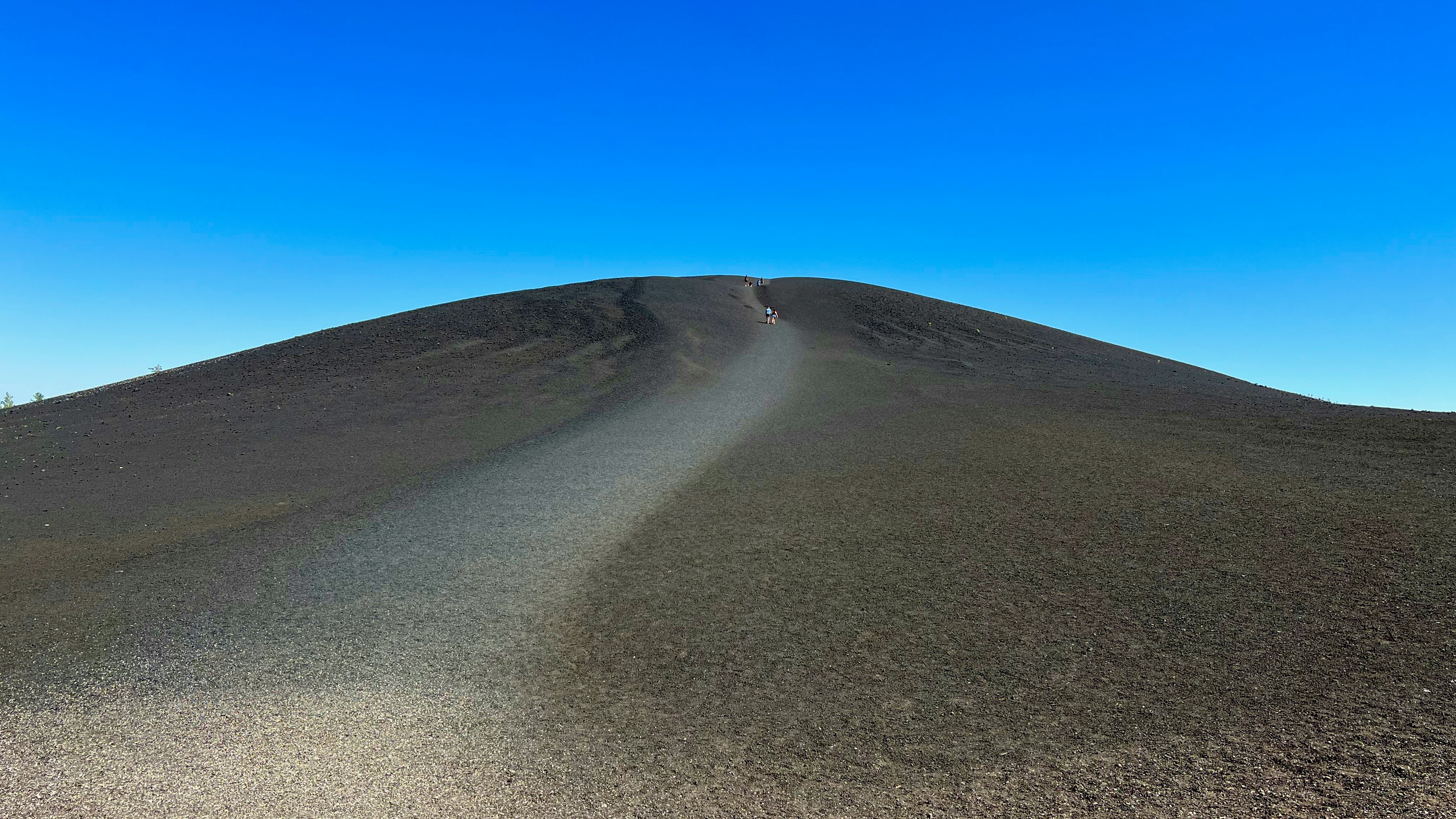 a person riding a bike down a hill