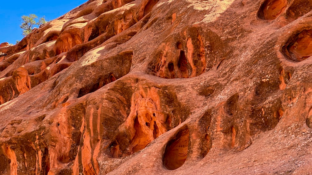 a large rock formation with holes in it