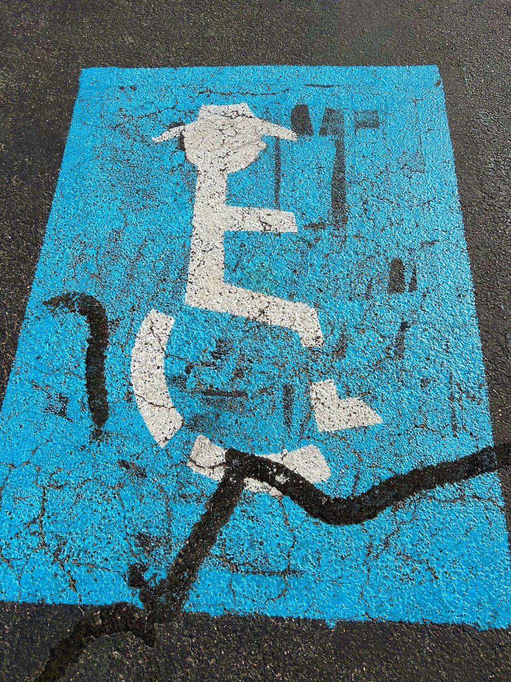 a picture of a street sign painted on the ground