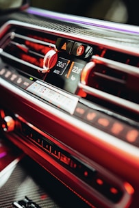 a car radio with a red dash light