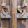 a close up of a wooden carving of two people