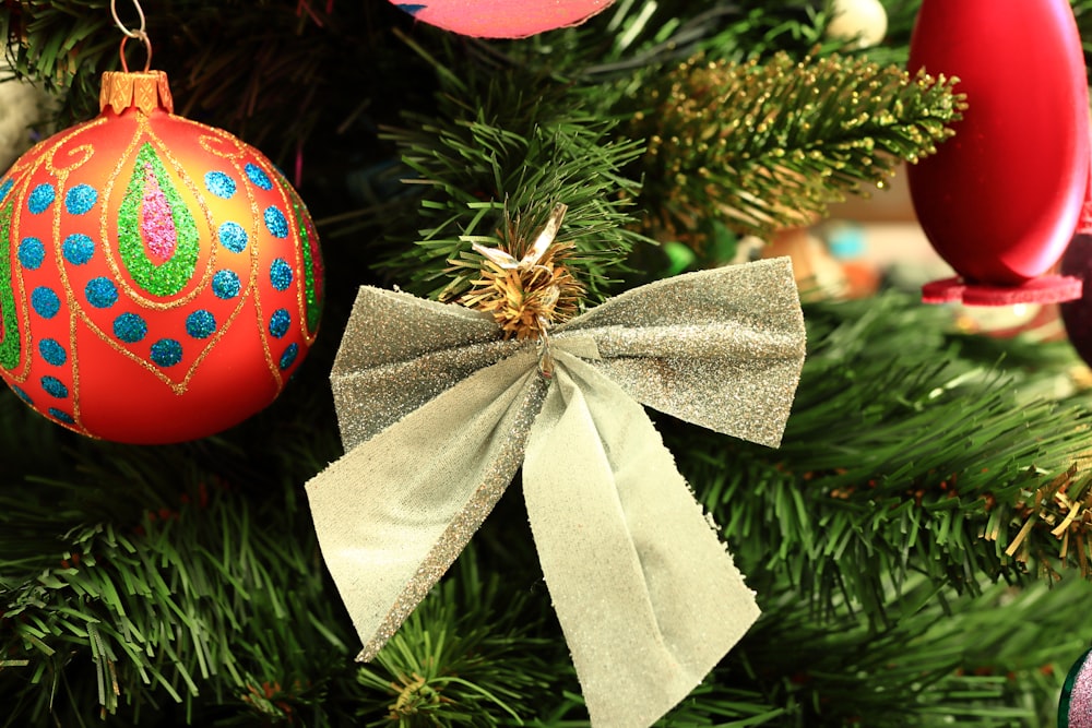 a close up of a christmas tree with ornaments